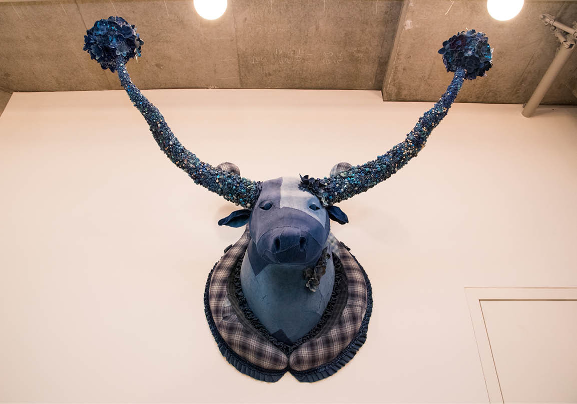 Photo of artwork hanging on wall.